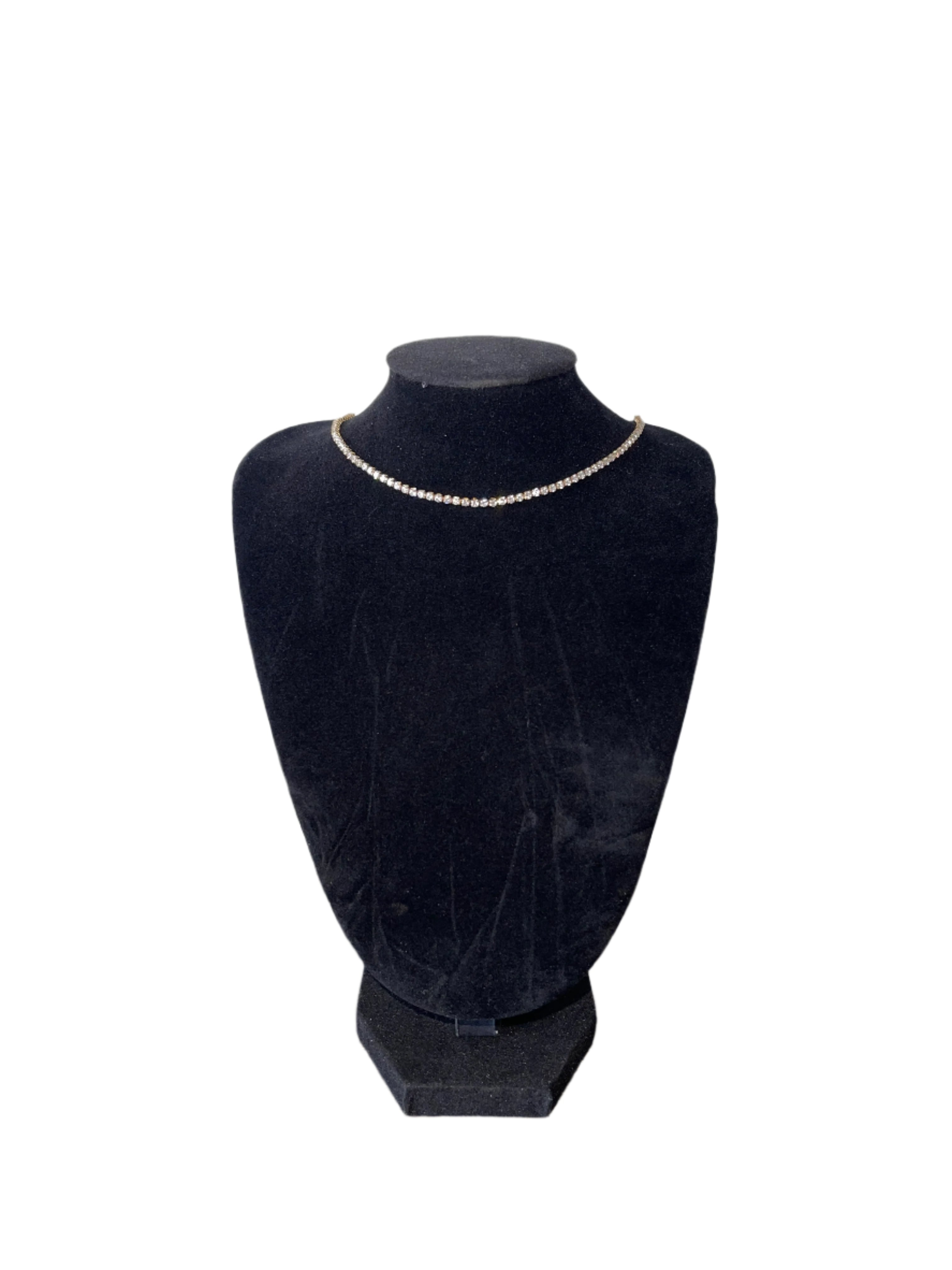 Elegant diamond necklace on display bust, featuring shimmering crystals and 18k gold-plated chain.