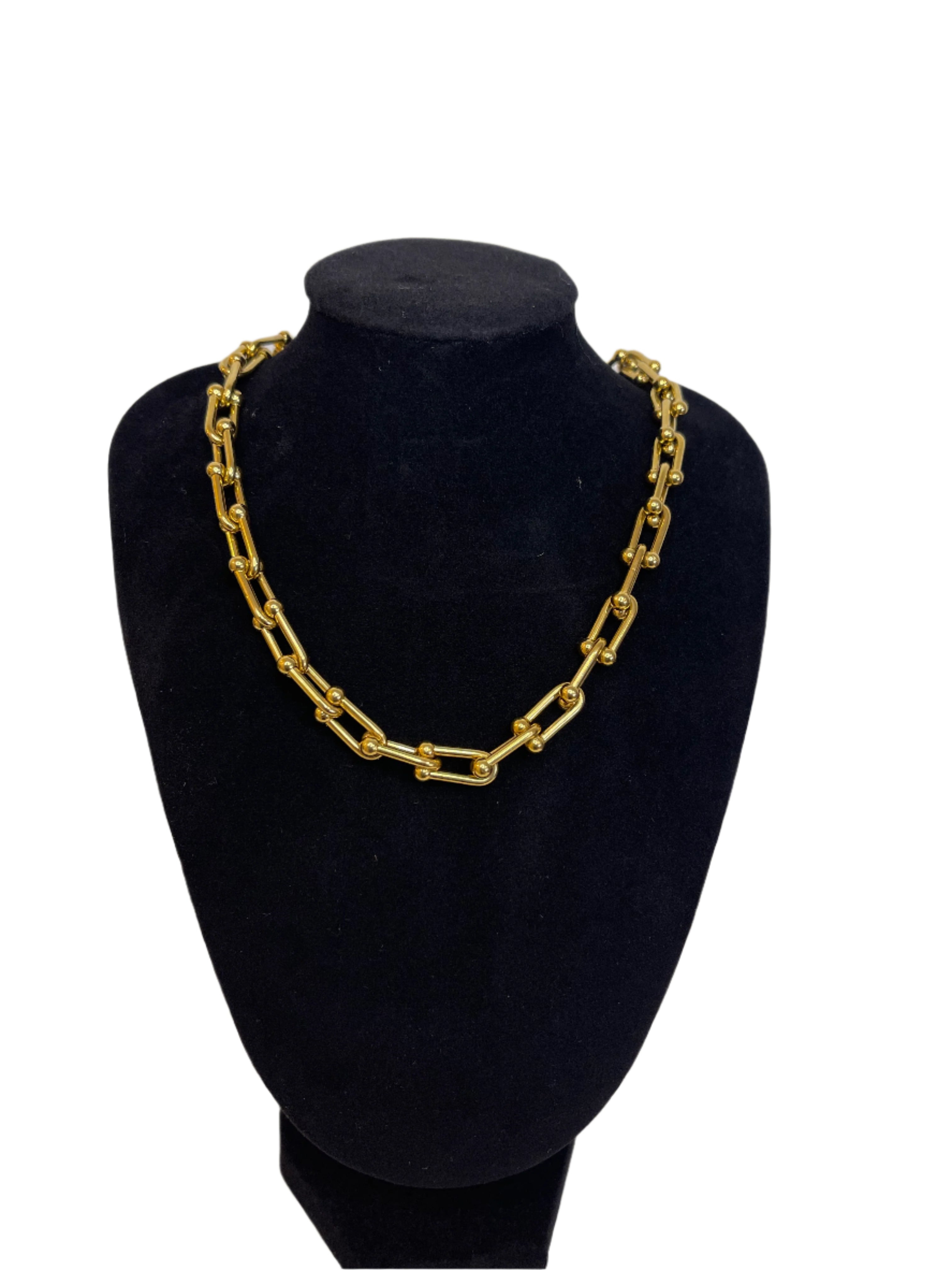 RAISSA U-link Choker Chain Necklace in 18k gold plated stainless steel with modern U-link design on black display bust