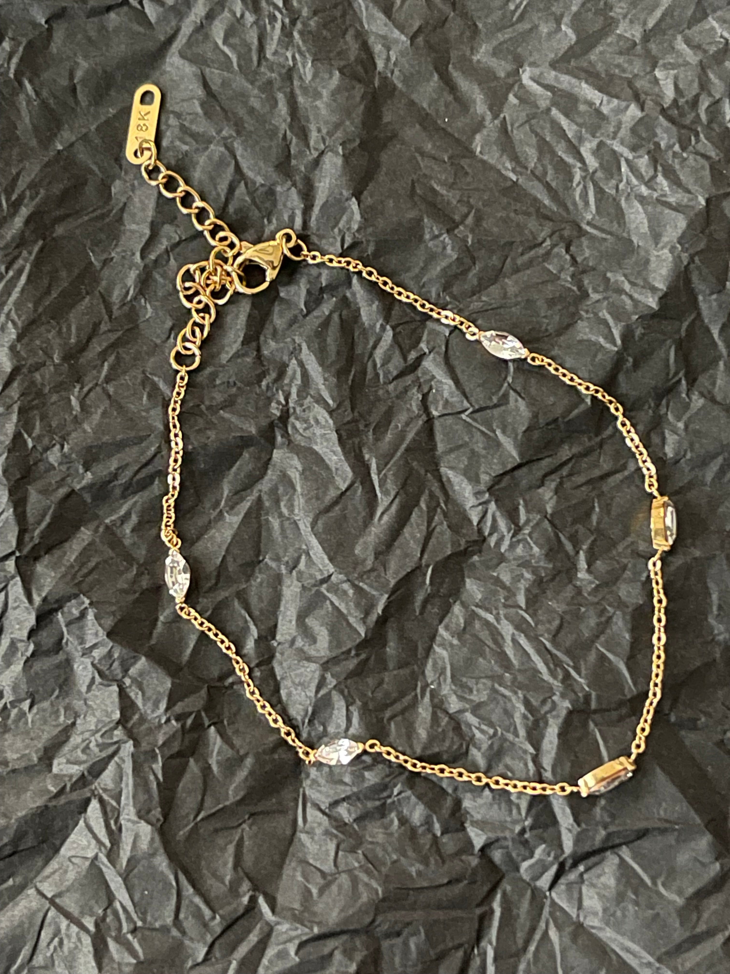 Delicate FREYA Anklet in gold-plated stainless steel with cubic zirconia accents.