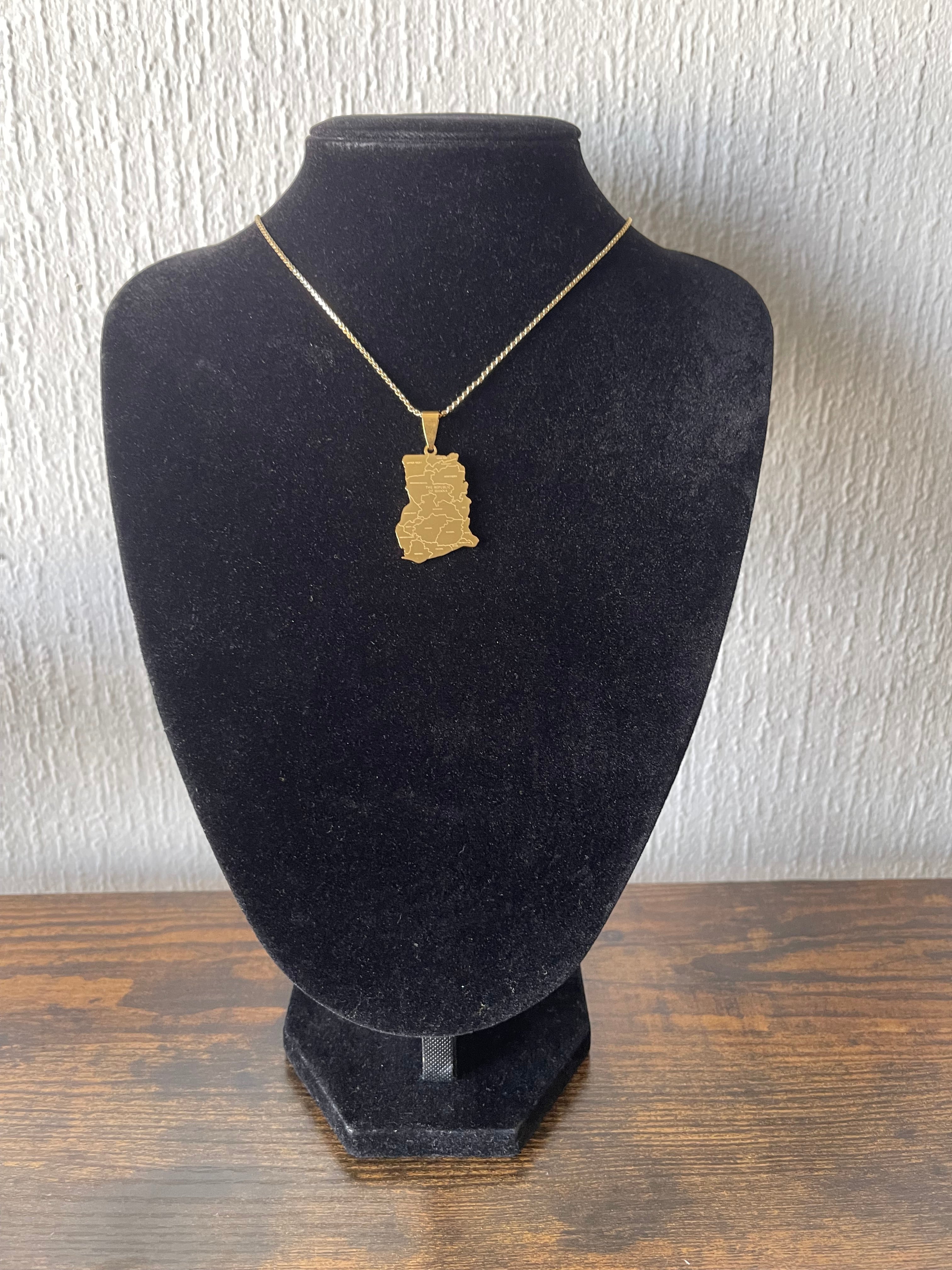 GHANA golden necklace on a black display, 18k gold plated stainless steel, 50 cm chain, water-resistant, allergy-free.