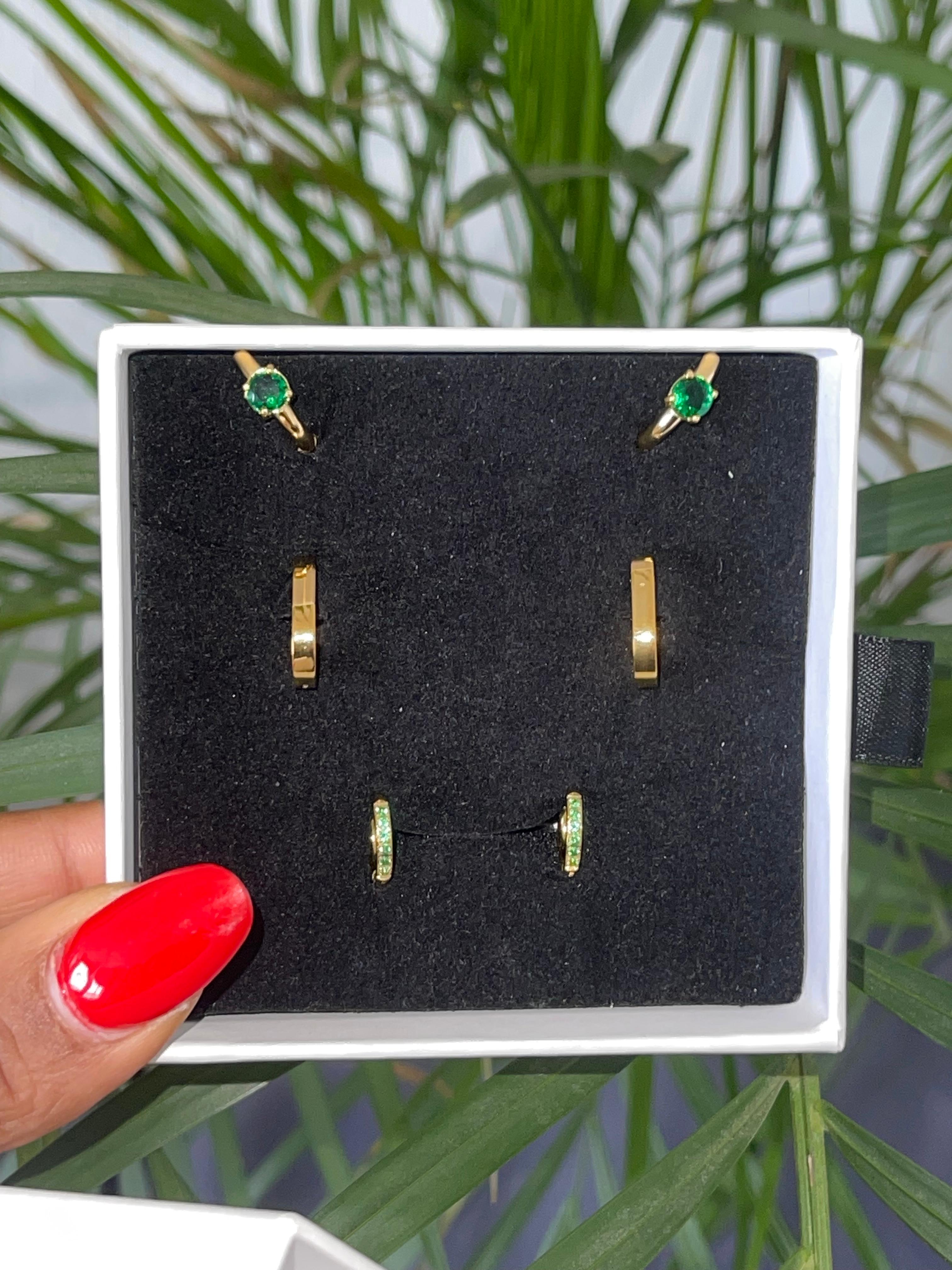 ELODIE Trio Set gold-plated earrings with emerald-green studs, gold mini hoops, and pavé green huggies in a black jewelry box
