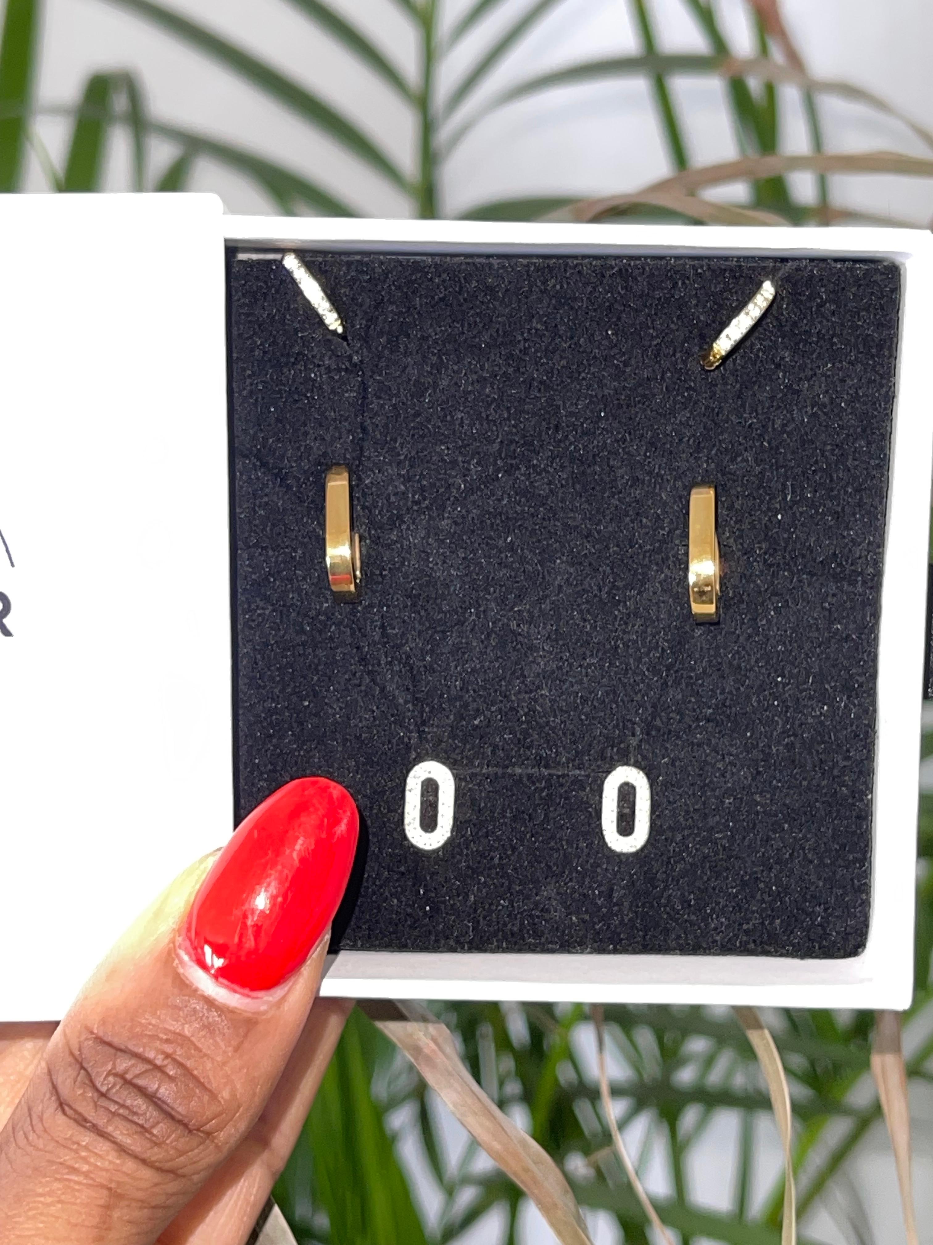 CELINE Trio Set gold hoops earrings in black velvet box held by hand with red nails