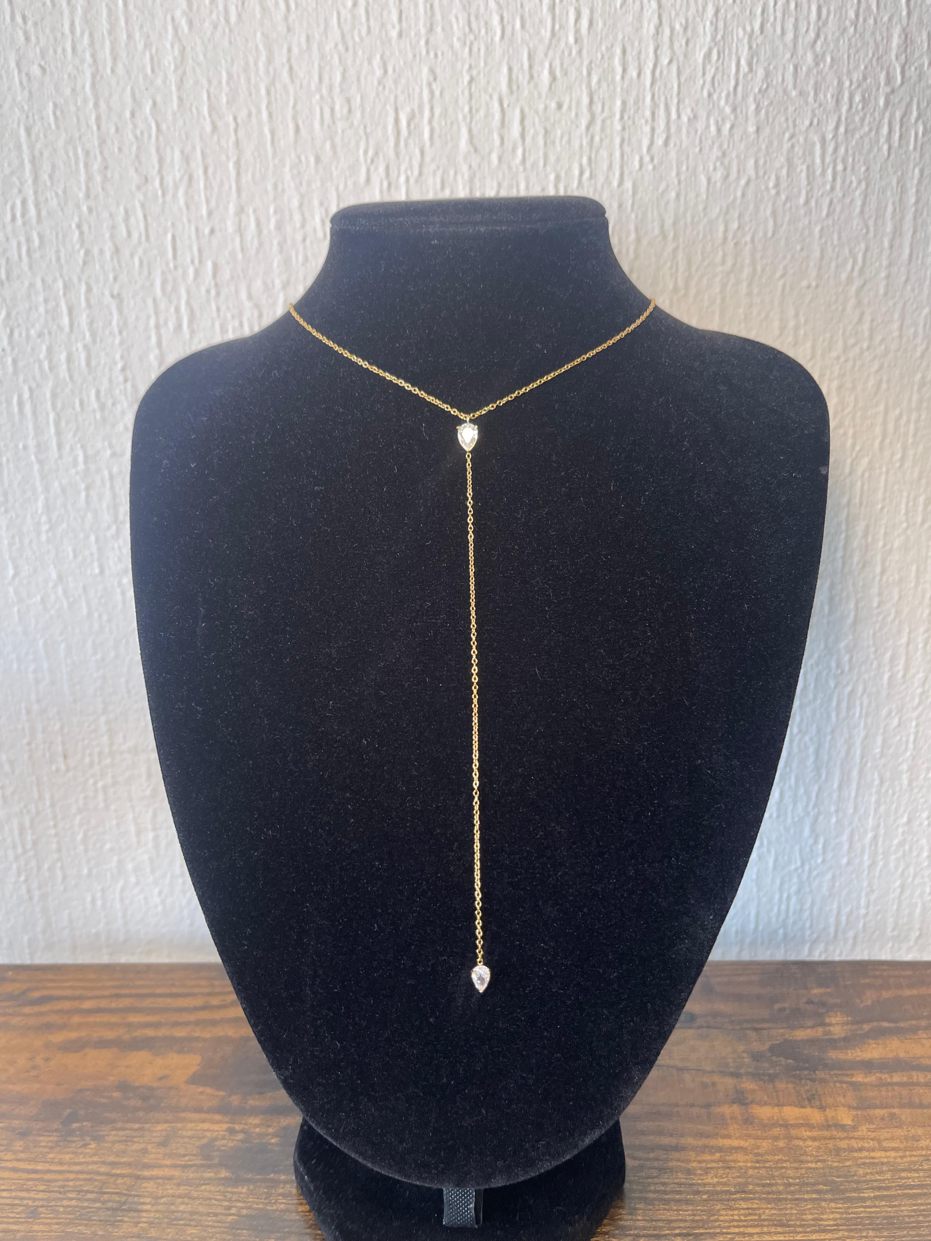 KENDALL Necklace with Y-shaped 18k gold-plated chain and pear-cut cubic zirconia drop charms on black display bust