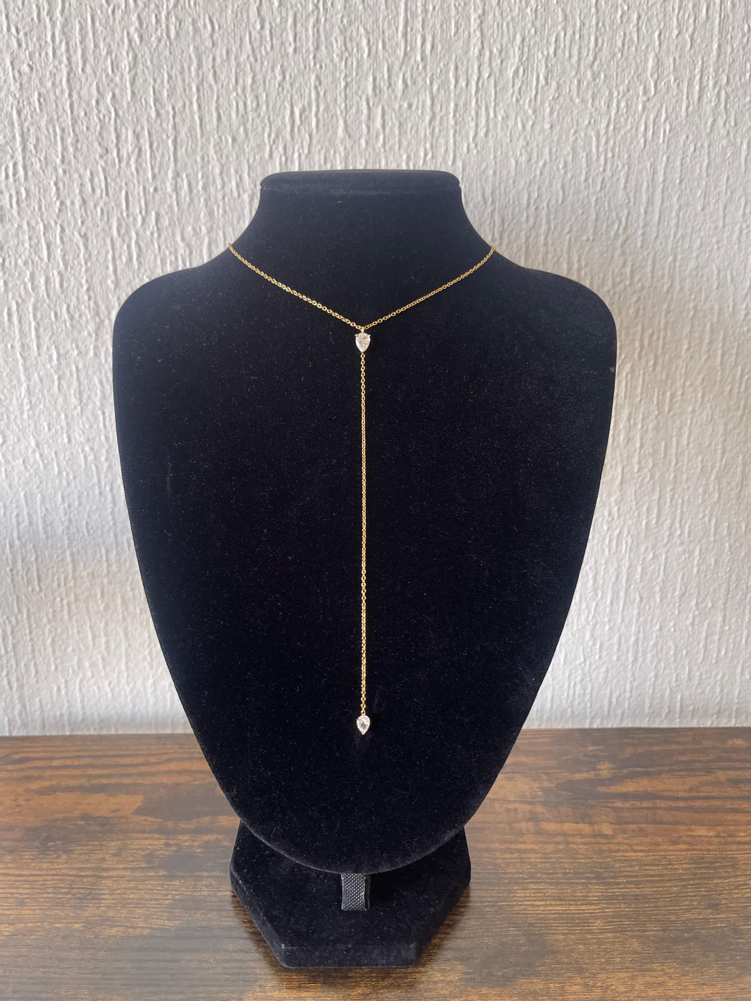 KENDALL Necklace Y-shaped 18k gold-plated chain with pear-cut cubic zirconia drop charms on black velvet display