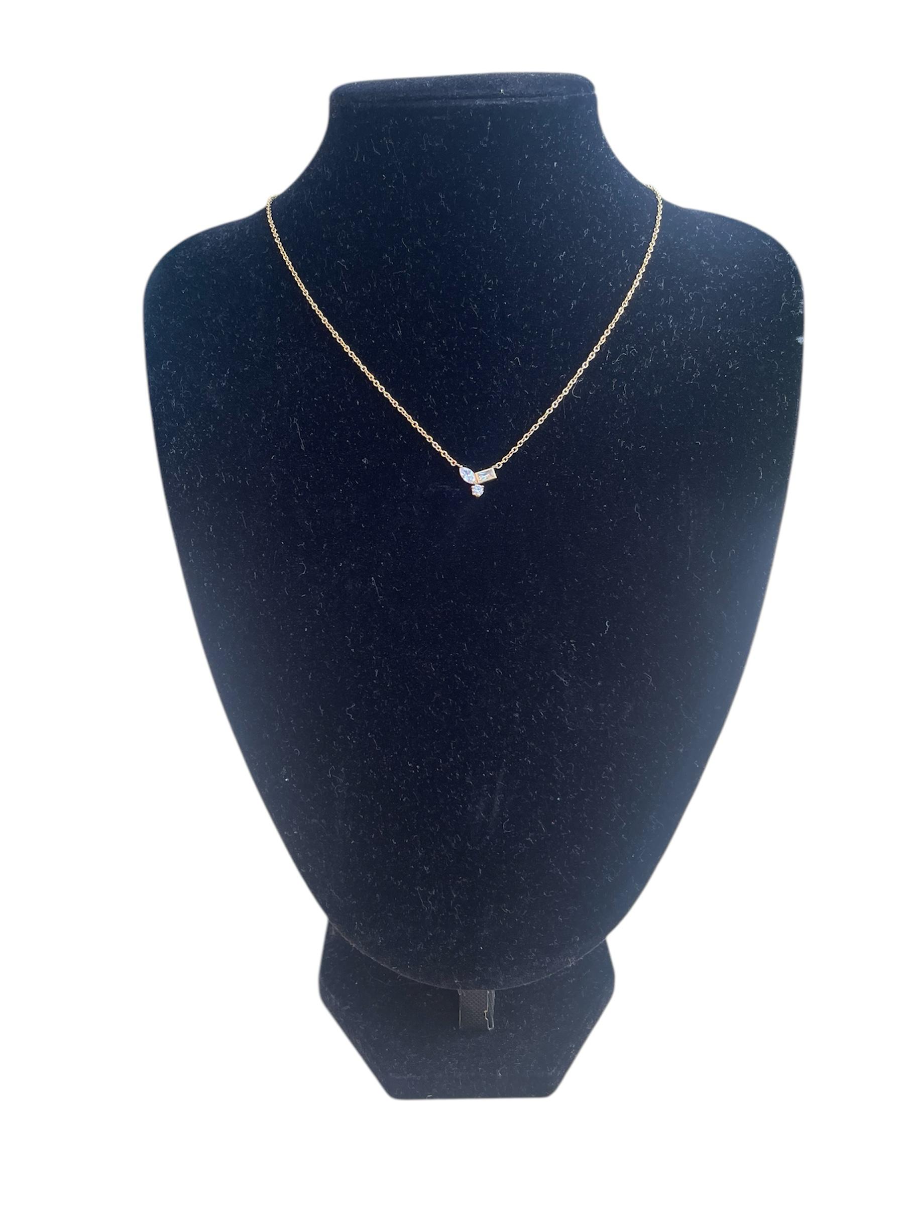 ZARIAH Mini Trio Crystal Necklace on display bust, features gold-plated chain with cubic zirconia stones.