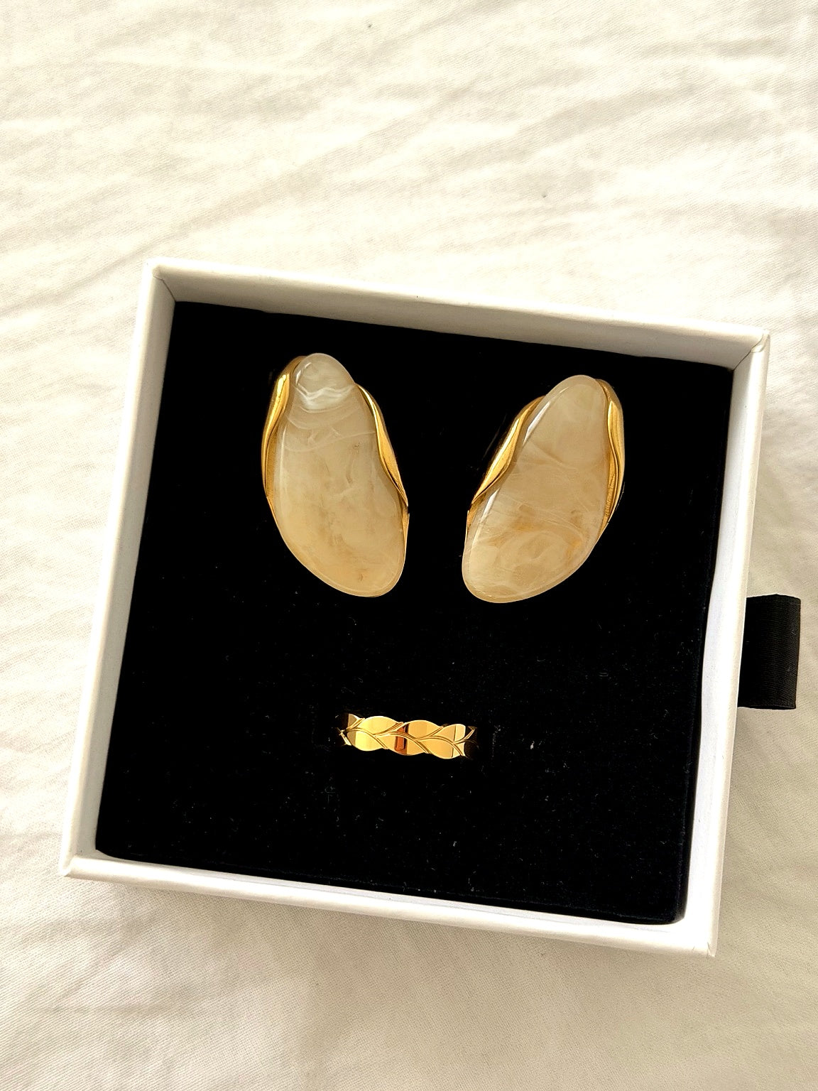 gold jewelry on white background 