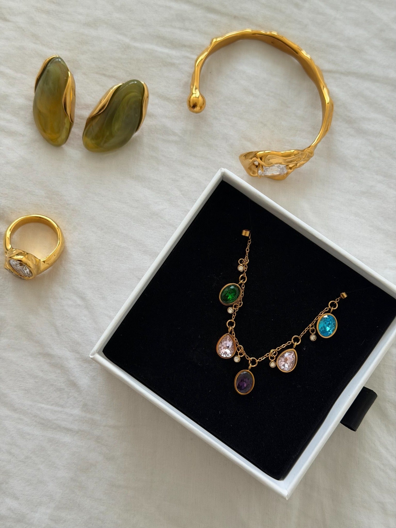 gold jewelry on white background 