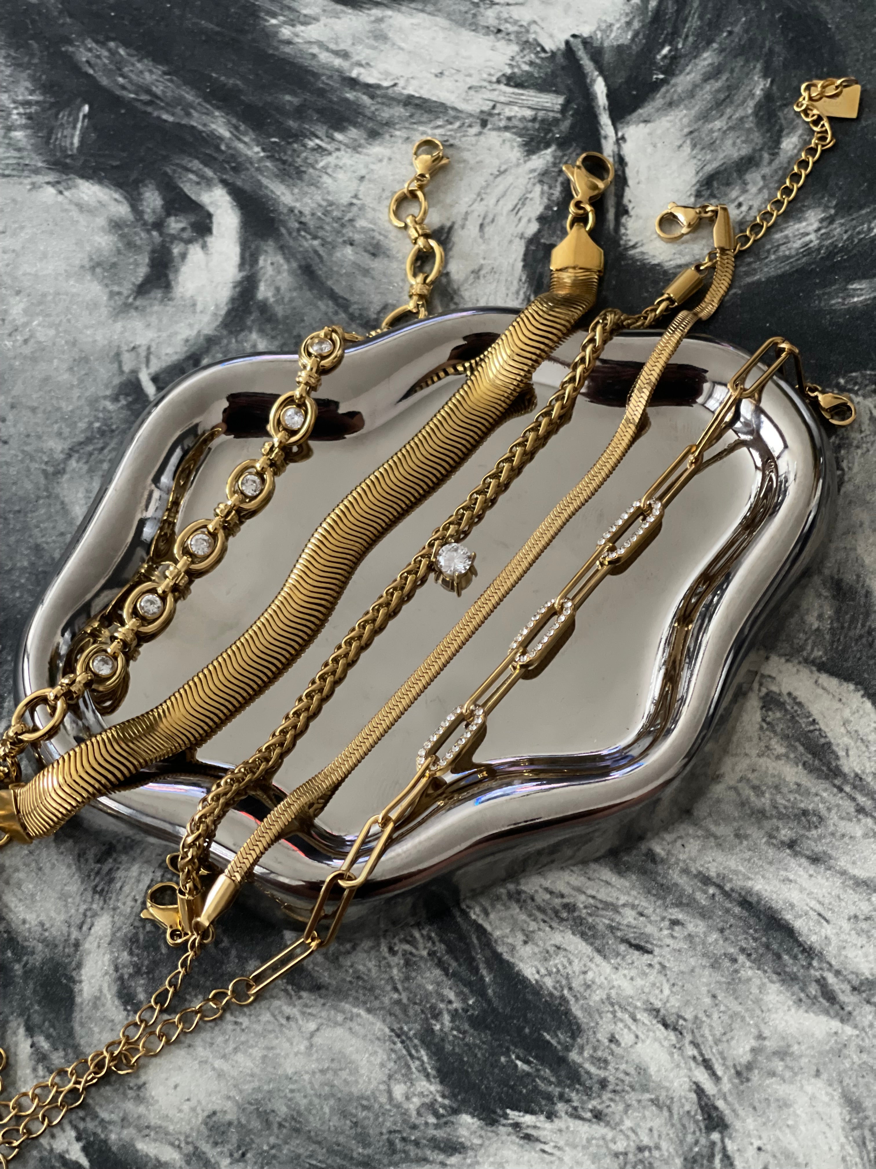 Gold-plated bracelets and bangles from The Halter Corner collection.