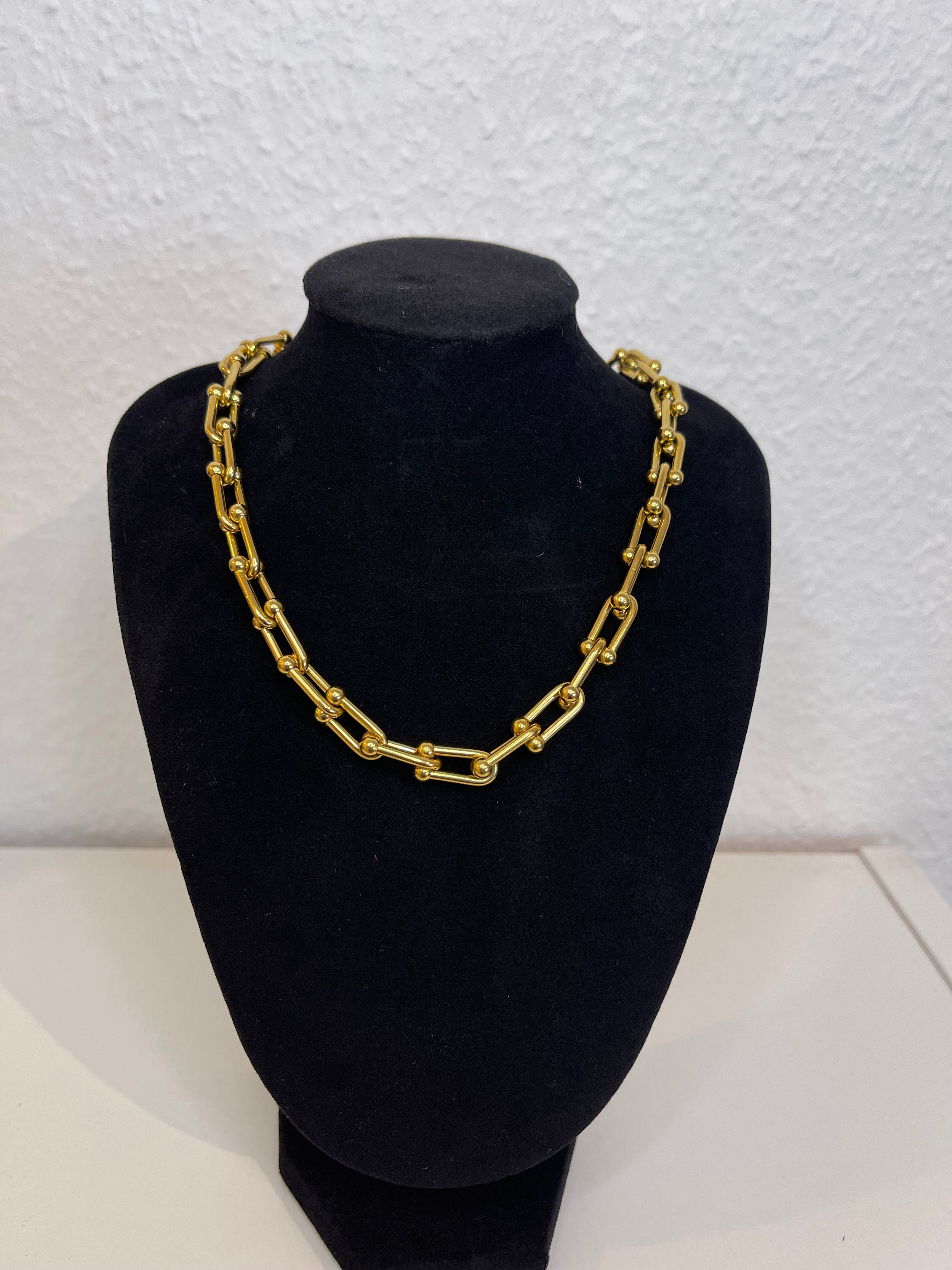High-quality waterproof necklace with a polished gold finish.