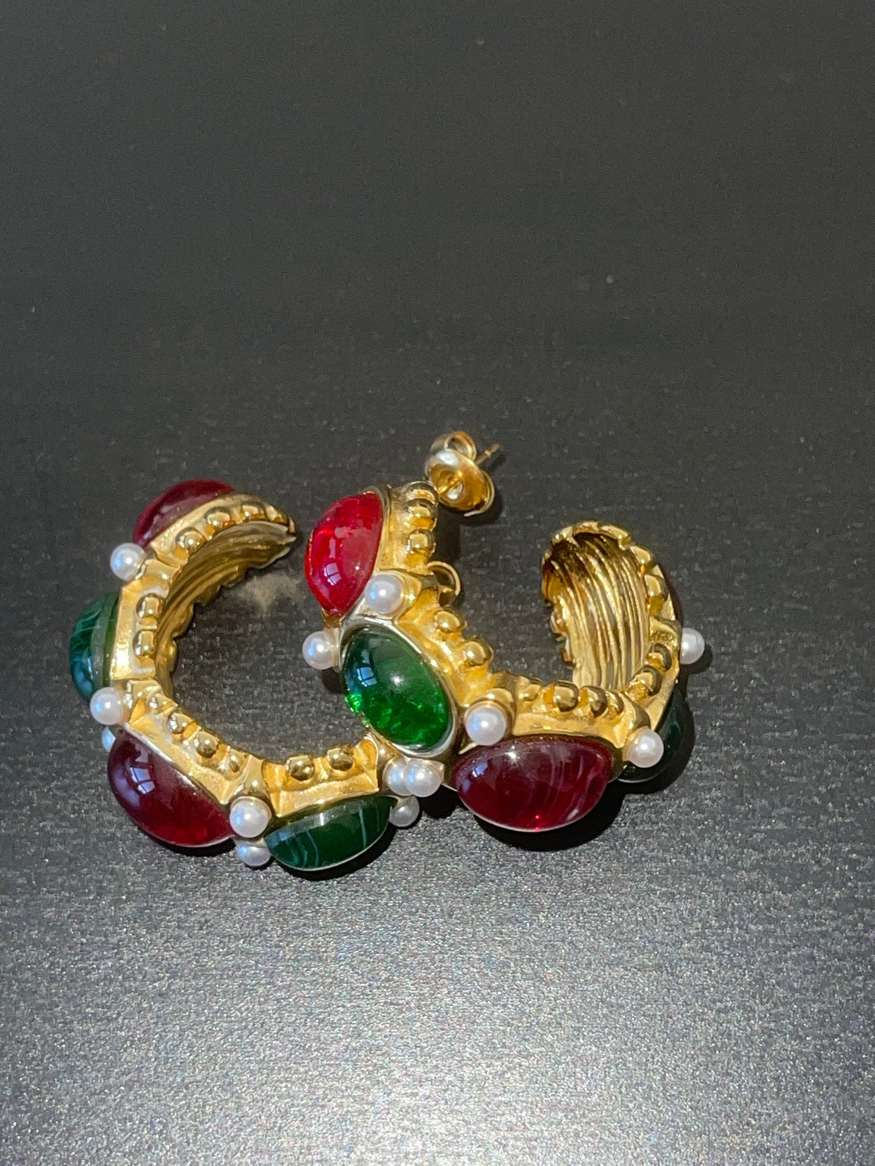 Close-up of MARJORIE glamour vintage hoop earrings on a white background